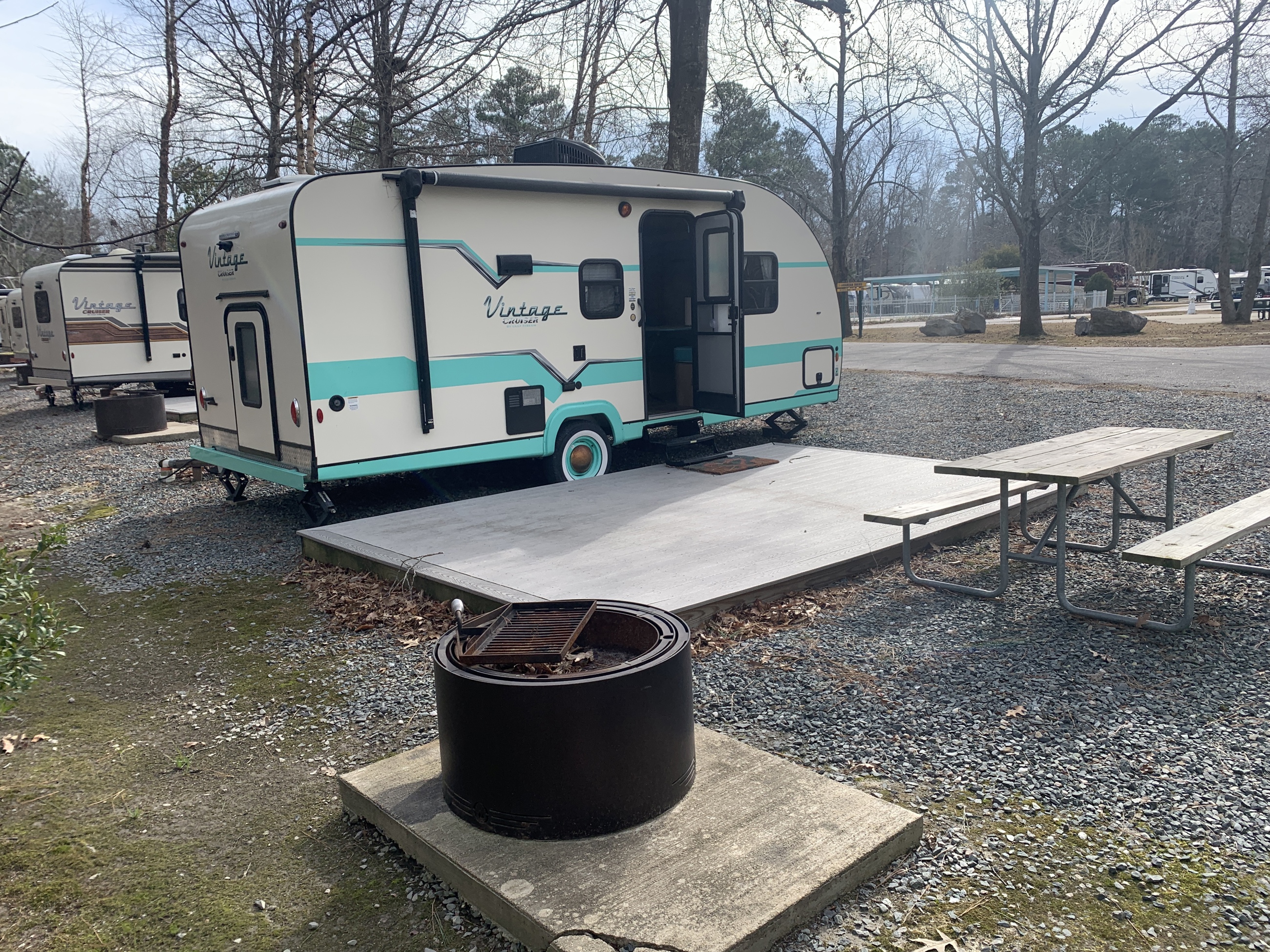 Vintage trailers feature firepit installations.