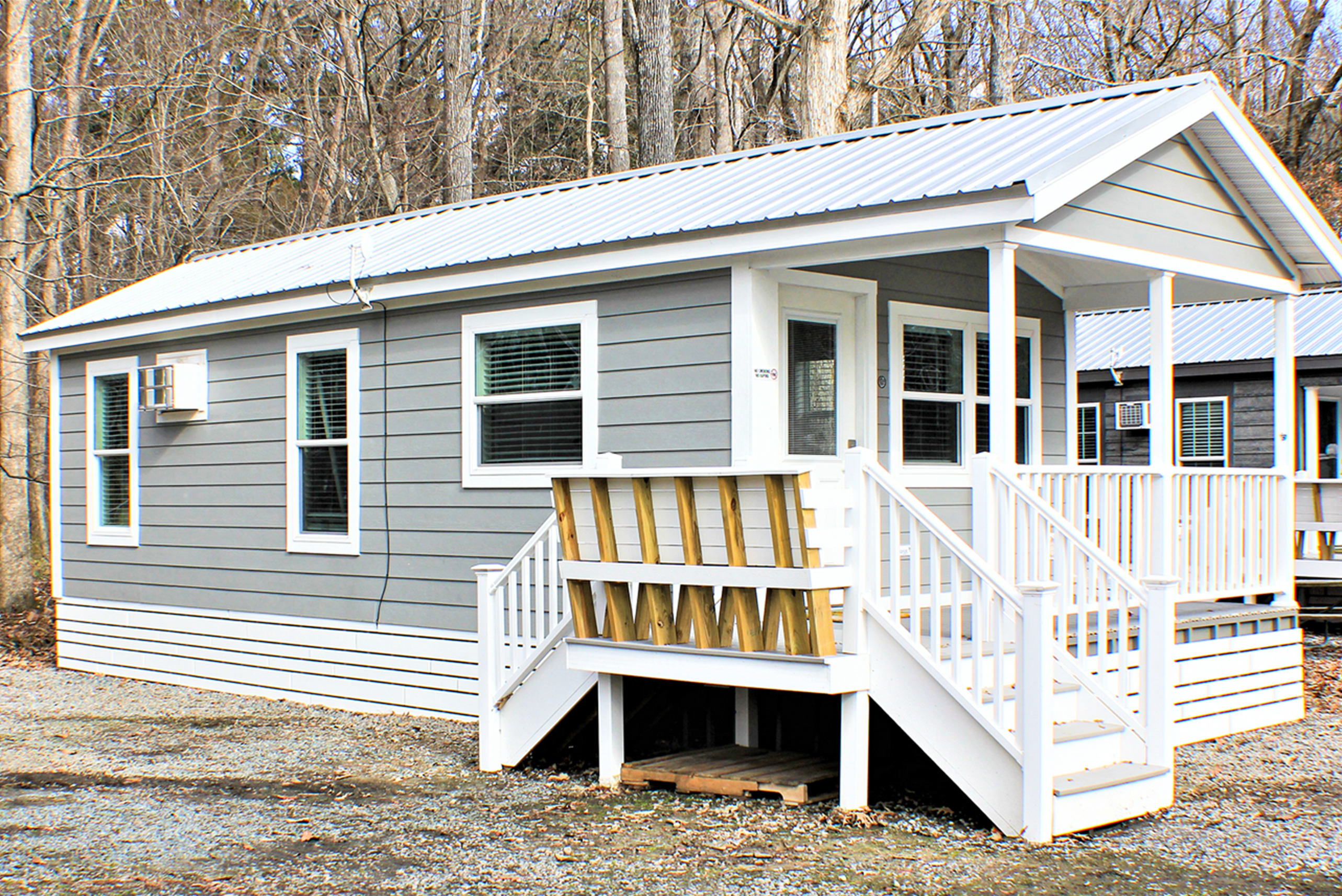Cottage exterior and deck with seating.