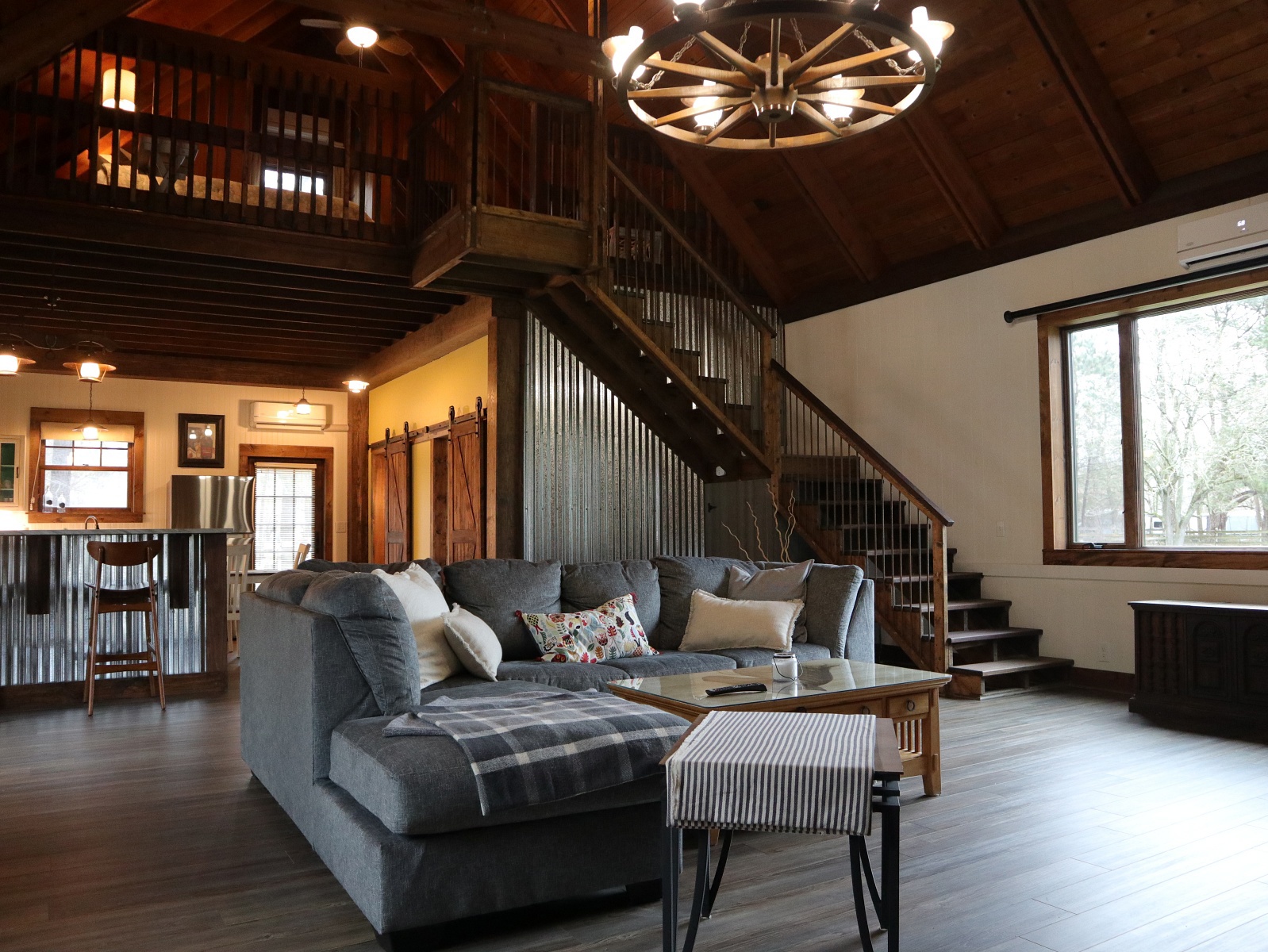 The Lodge includes a large living space, a full kitchen and bathroom, and two bedrooms.