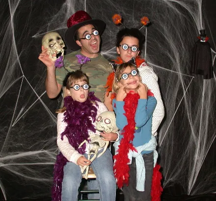 Family wearing Halloween costumes