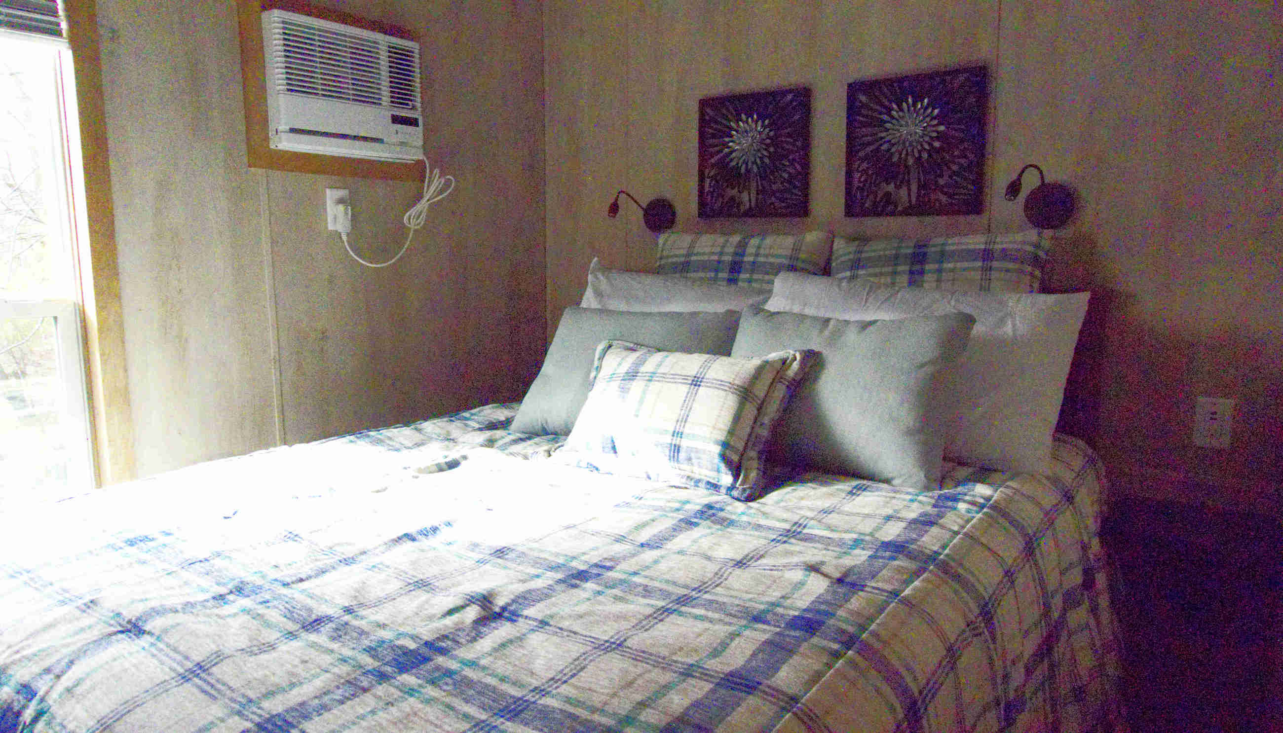 Book a cottage for a queen sized bed with linens supplied.
